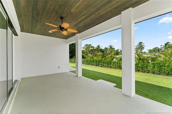 a view of a room with porch and wooden floor