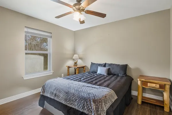 a bedroom with a bed and a window