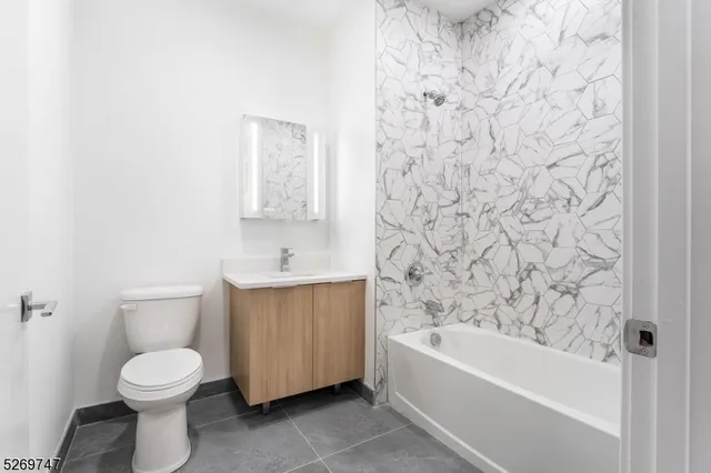 a front view of a building with parking space