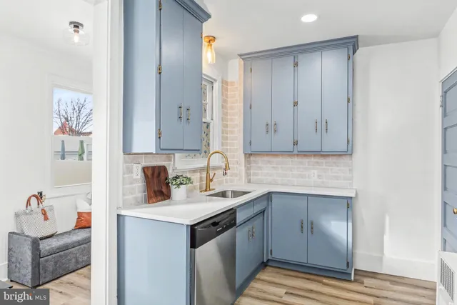 a kitchen with a sink and a refrigerator