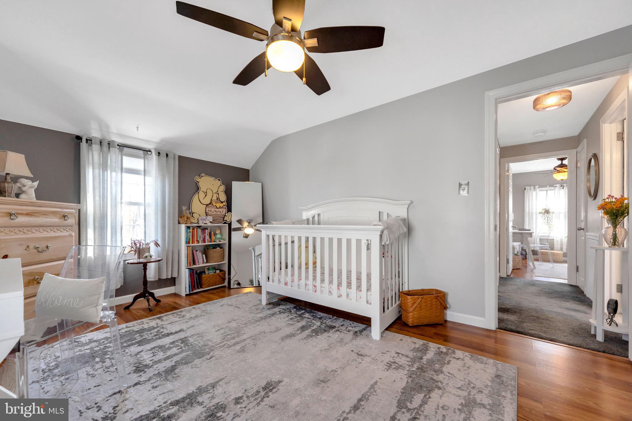 409 Holmes Road Morton, PA 19070 - Photo 20 of 55 a bedroom with a bed and wooden floor