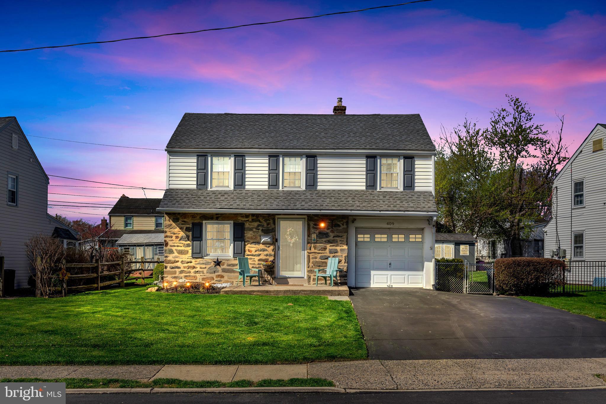 409 Holmes Road Morton, PA 19070 - Photo 2 of 55 a front view of a house with a yard