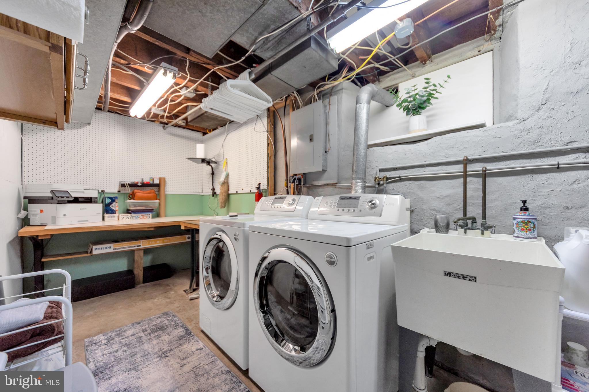 409 Holmes Road Morton, PA 19070 - Photo 28 of 55 a utility room with dryer and washer