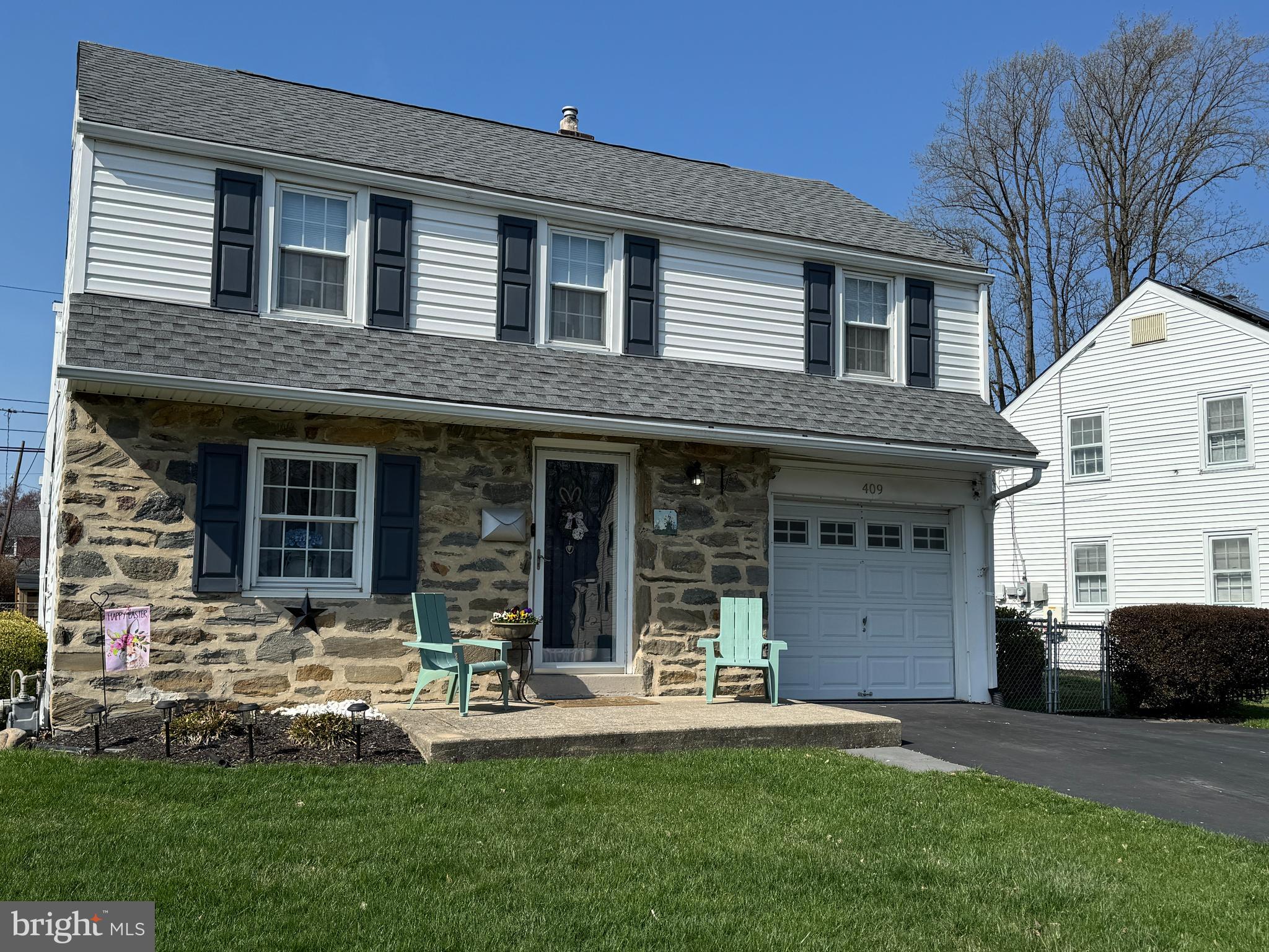 409 Holmes Road Morton, PA 19070 - Photo 3 of 55 a front view of a house with a yard and potted plants
