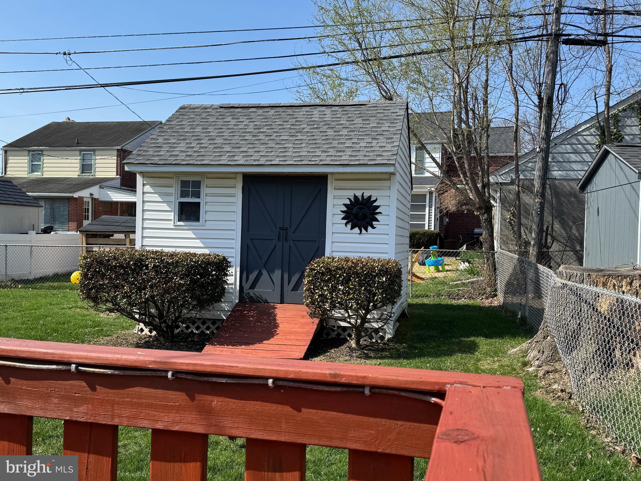 409 Holmes Road Morton, PA 19070 - Photo 32 of 55 a front view of house with yard outdoor seating and barbeque oven
