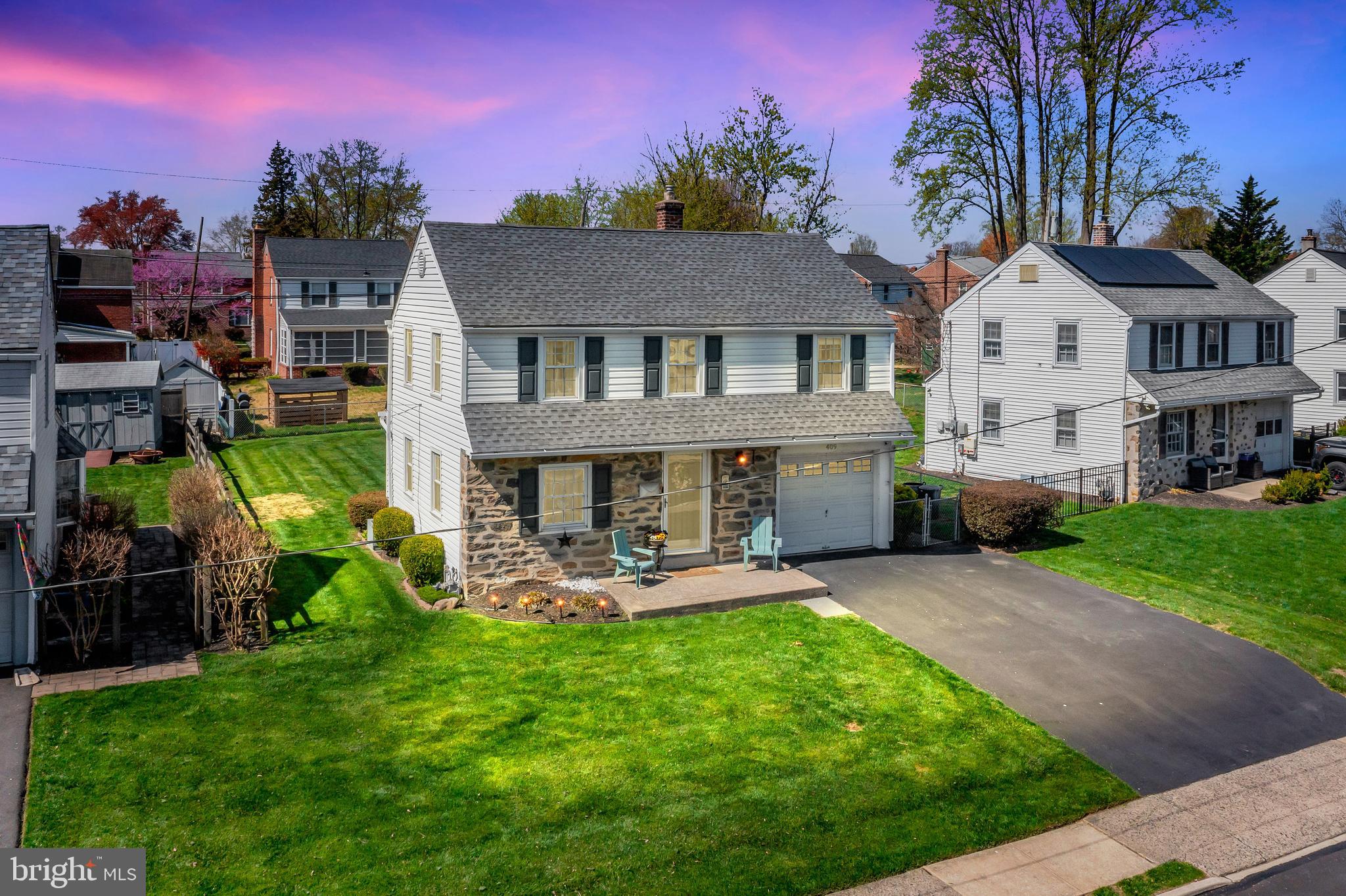 409 Holmes Road Morton, PA 19070 - Photo 39 of 55 a view of a house with backyard sitting area and garden