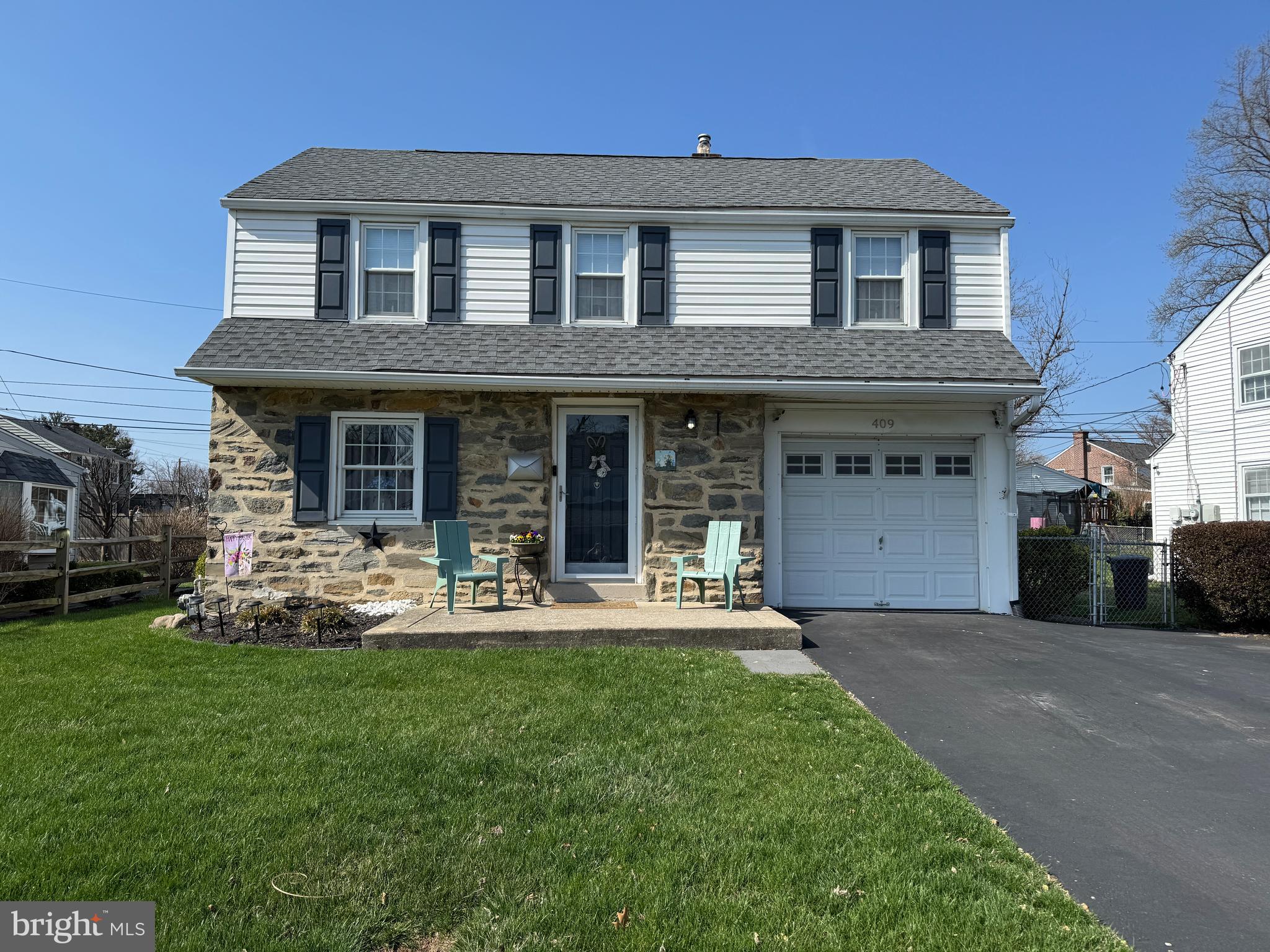 409 Holmes Road Morton, PA 19070 - Photo 4 of 55 a front view of a house with a yard and porch