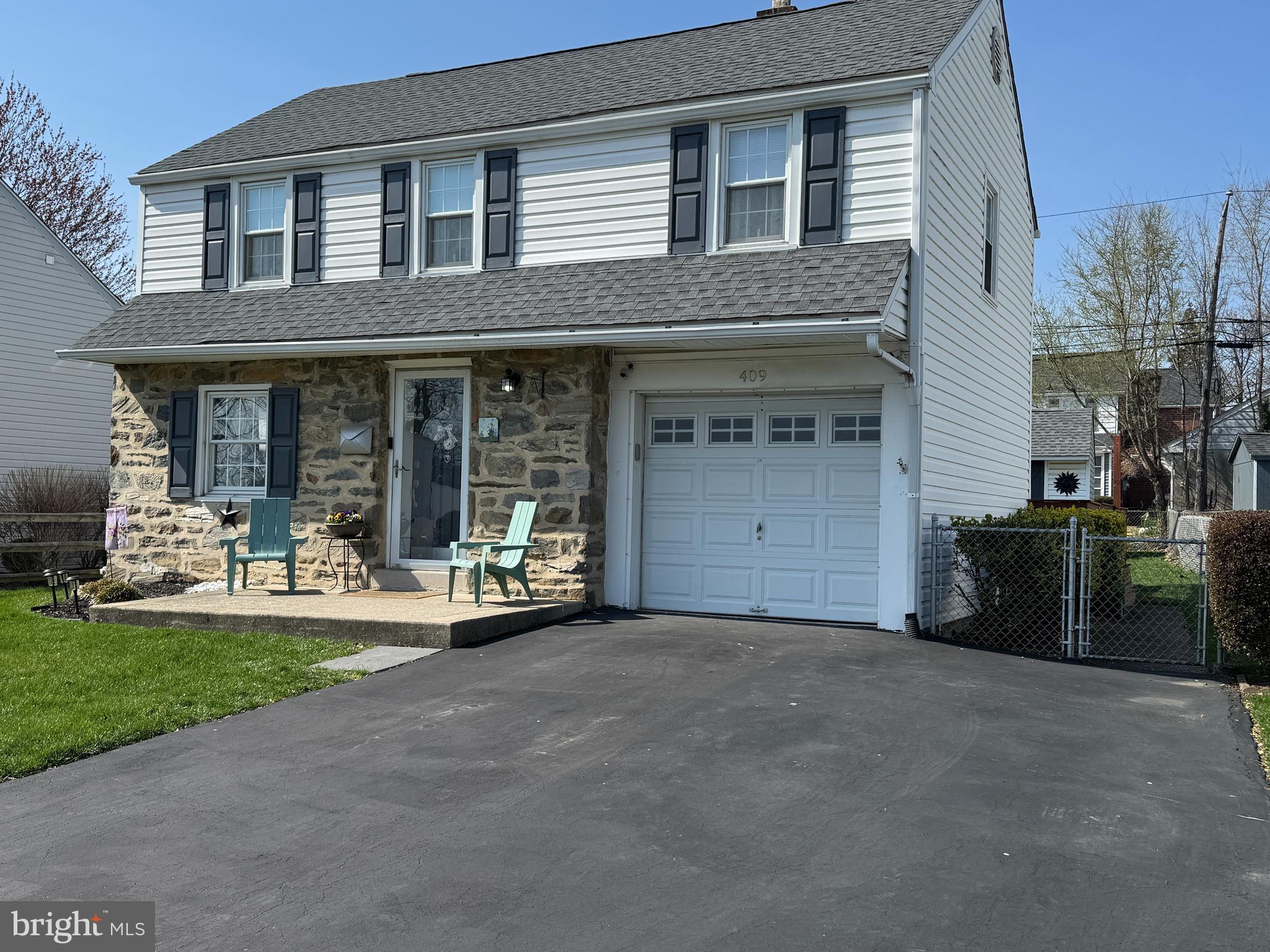 409 Holmes Road Morton, PA 19070 - Photo 54 of 55 a view of a house with a yard and sitting area
