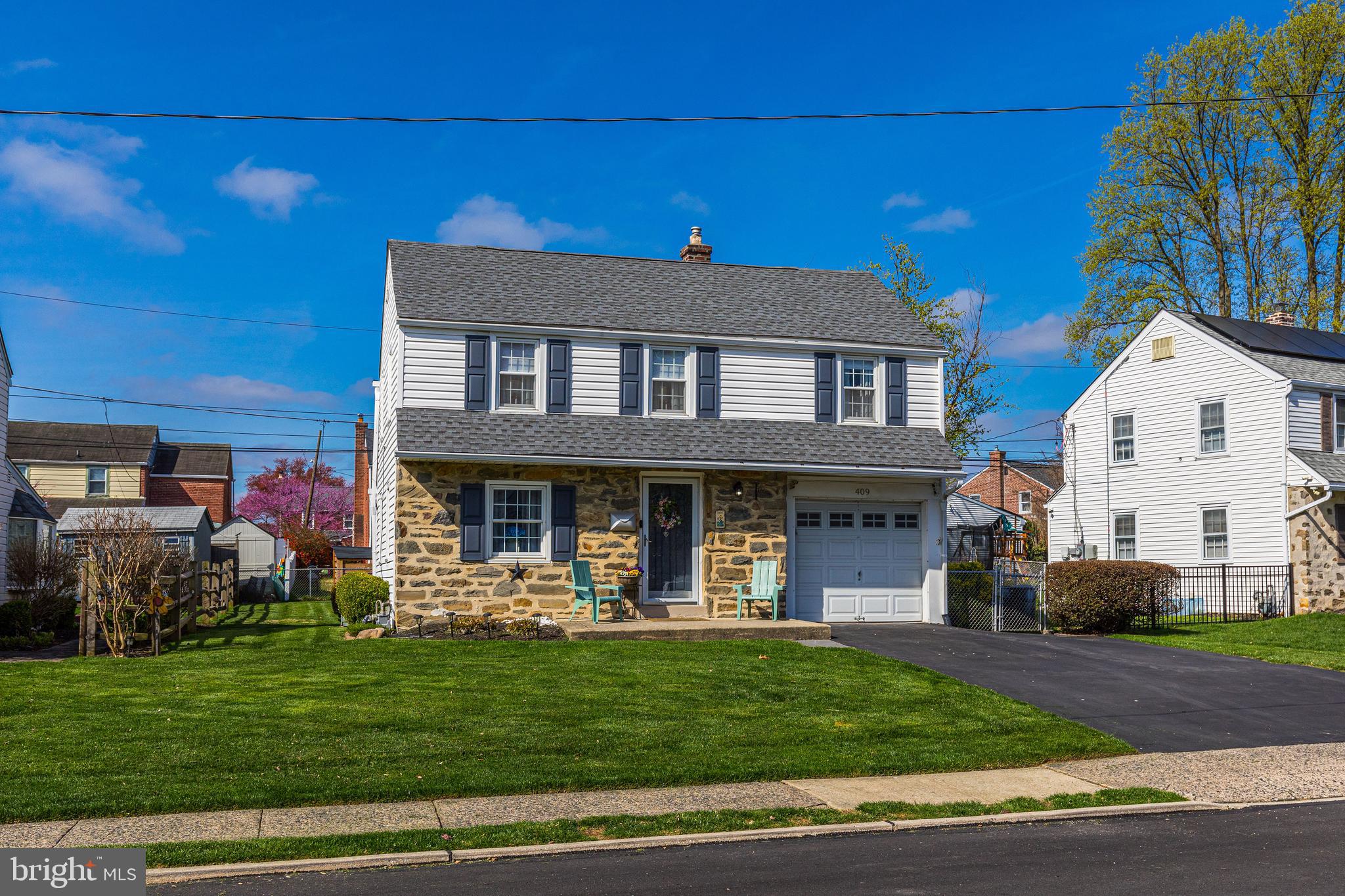 409 Holmes Road Morton, PA 19070 - Photo 55 of 55 a front view of a house with a yard table and chairs