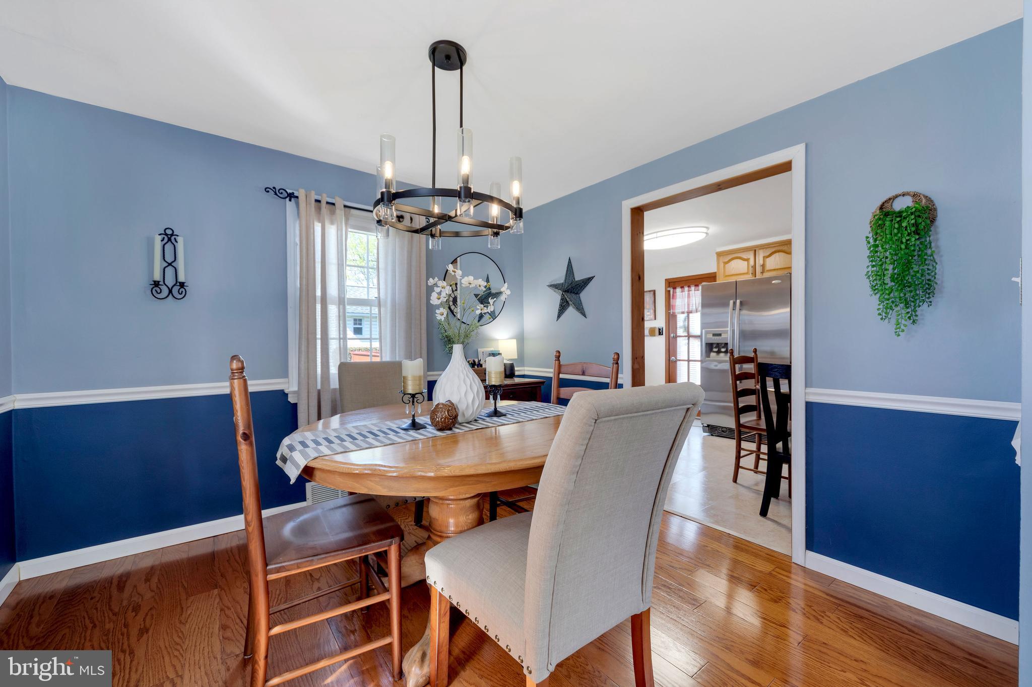 409 Holmes Road Morton, PA 19070 - Photo 8 of 55 a view of a dining room with furniture window and wooden floor