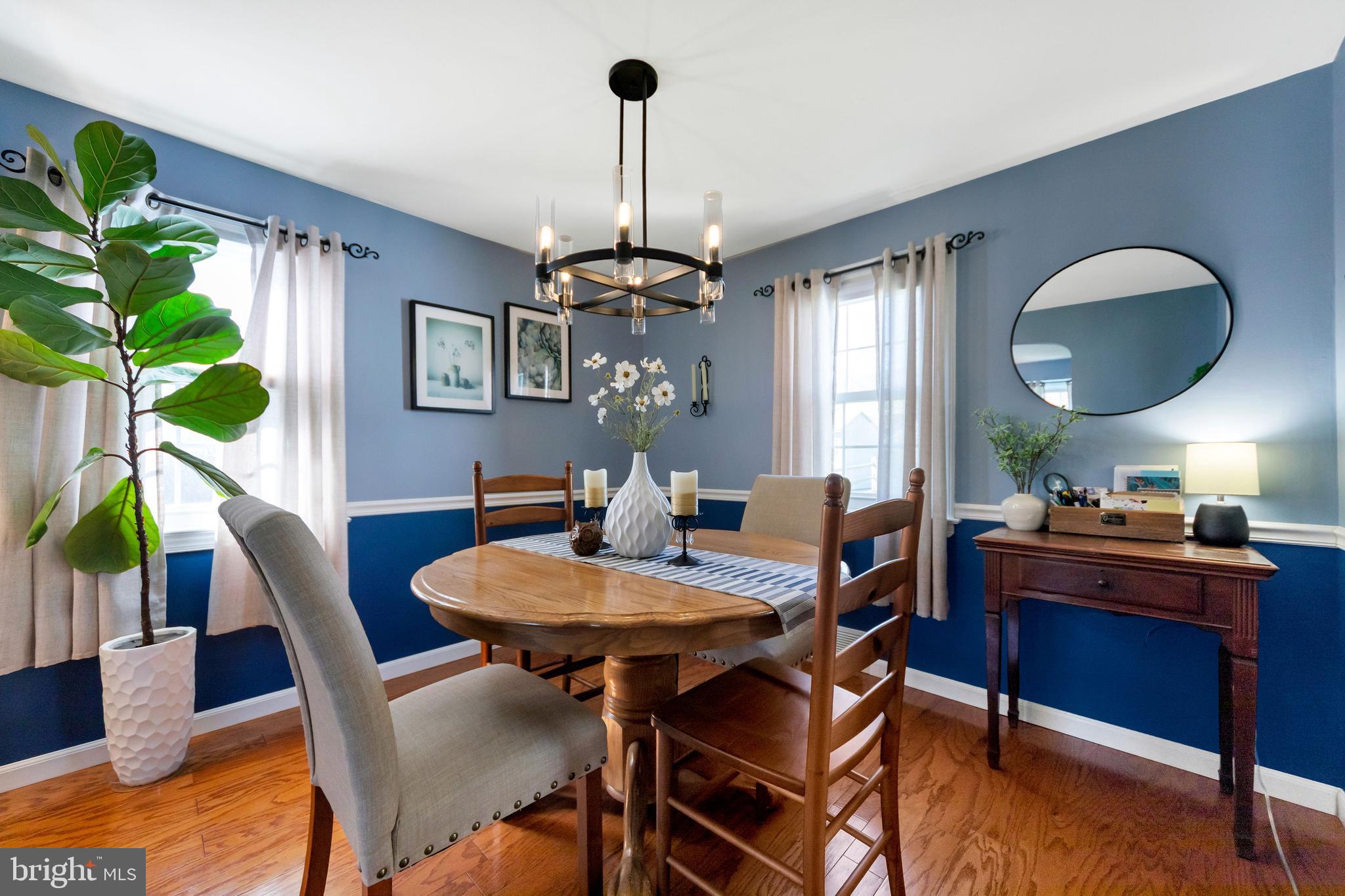 409 Holmes Road Morton, PA 19070 - Photo 10 of 55 a view of a dining room with furniture window and wooden floor
