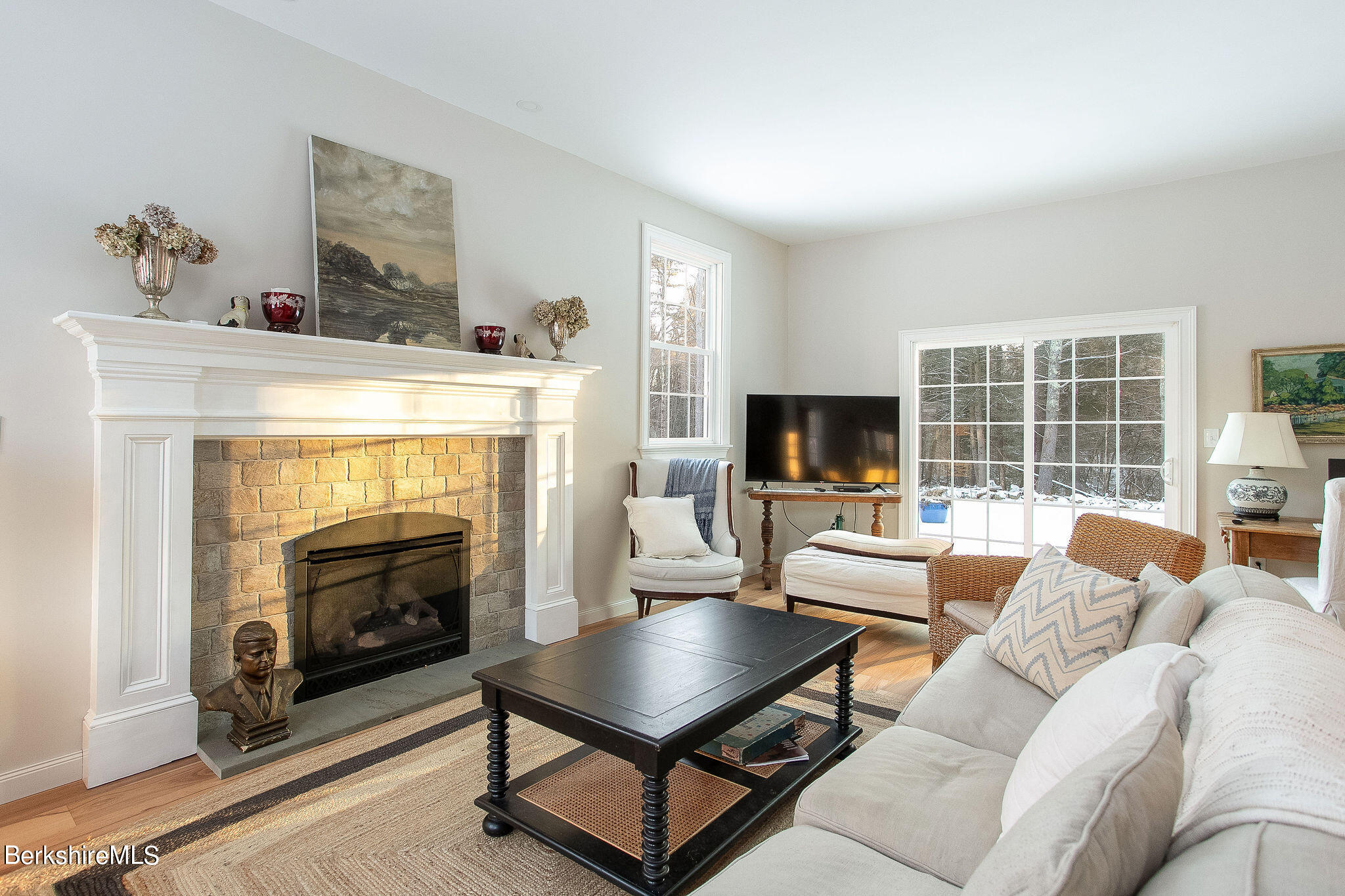 897 Canaan Valley Road New Marlborough, MA 01259 - Photo 15 of 50 a living room with furniture a flat screen tv and a fireplace