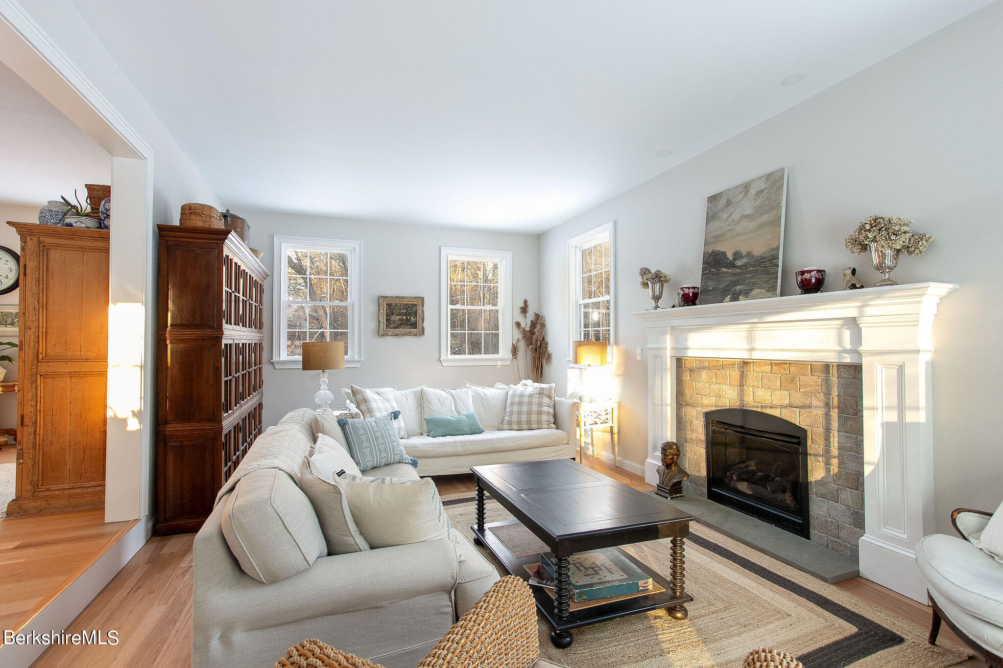 897 Canaan Valley Road New Marlborough, MA 01259 - Photo 16 of 50 a living room with furniture a fireplace and a flat screen tv