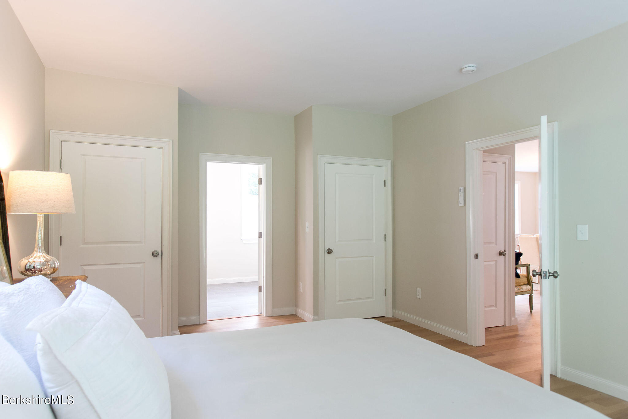 897 Canaan Valley Road New Marlborough, MA 01259 - Photo 21 of 50 a bedroom with a bed and a lamp