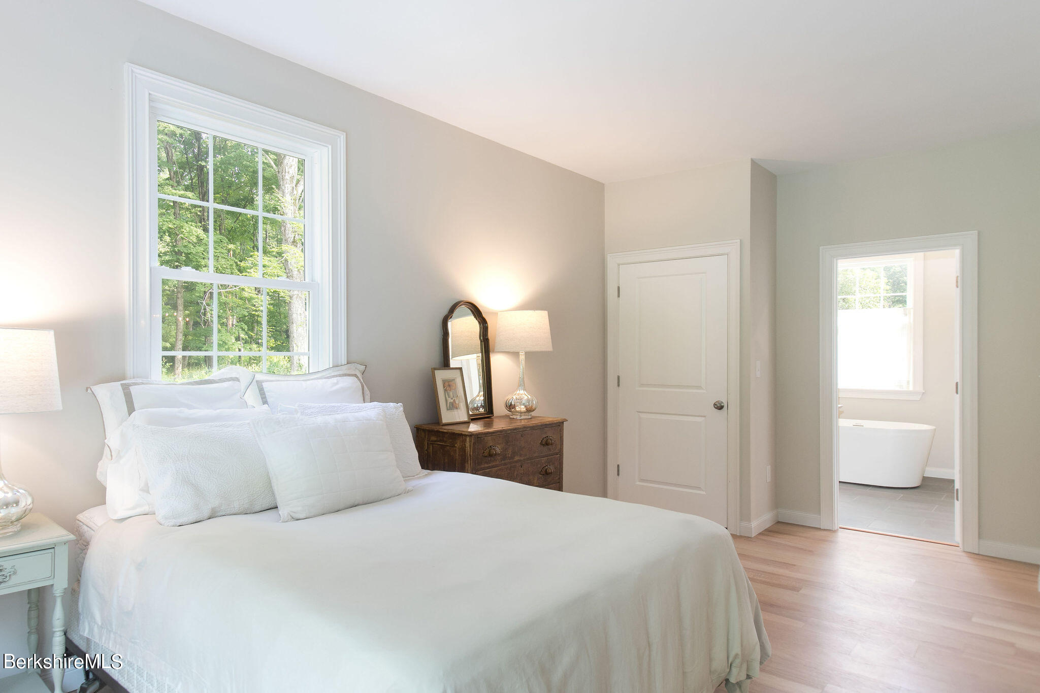 897 Canaan Valley Road New Marlborough, MA 01259 - Photo 22 of 50 a bedroom with a bed and a large window