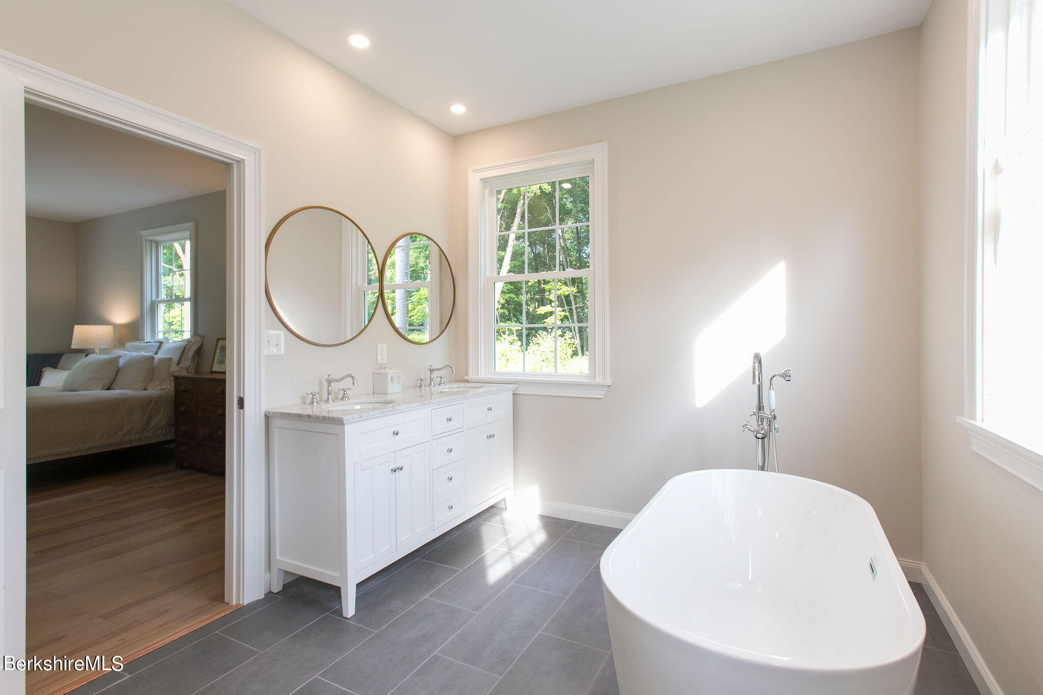 897 Canaan Valley Road New Marlborough, MA 01259 - Photo 23 of 50 a en suite bathroom with a toilet a sink and a mirror