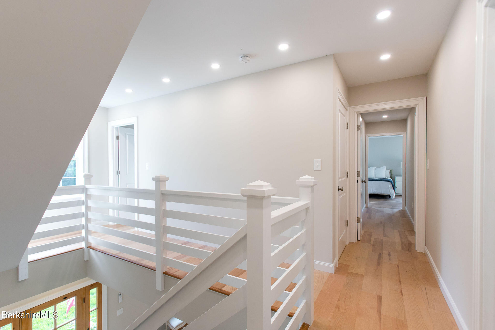 897 Canaan Valley Road New Marlborough, MA 01259 - Photo 26 of 50 a view of a hallway with wooden floor and staircase