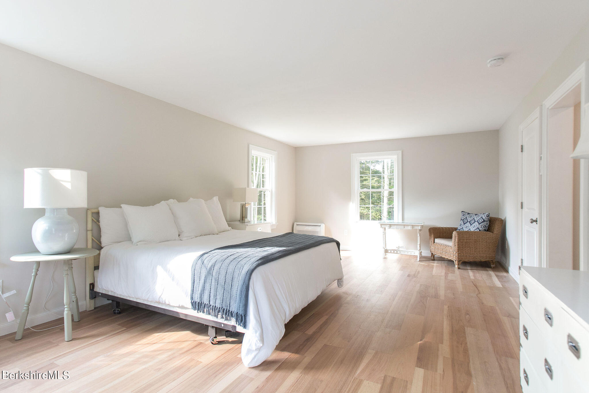897 Canaan Valley Road New Marlborough, MA 01259 - Photo 27 of 50 a bedroom with a bed and wooden floor