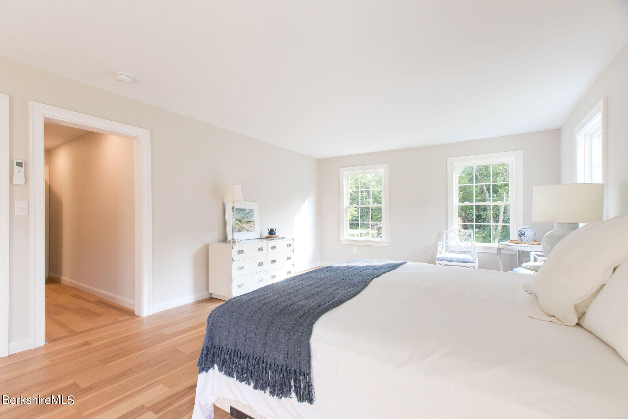 897 Canaan Valley Road New Marlborough, MA 01259 - Photo 28 of 50 a bedroom with a bed and wooden floor