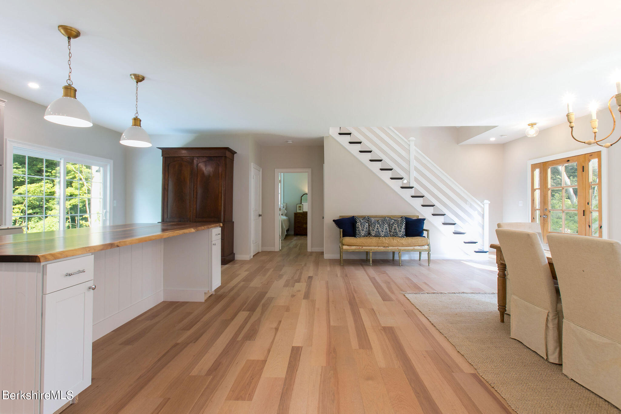 897 Canaan Valley Road New Marlborough, MA 01259 - Photo 5 of 50 a large white kitchen with granite countertop a stove a sink dishwasher and a wooden cabinets