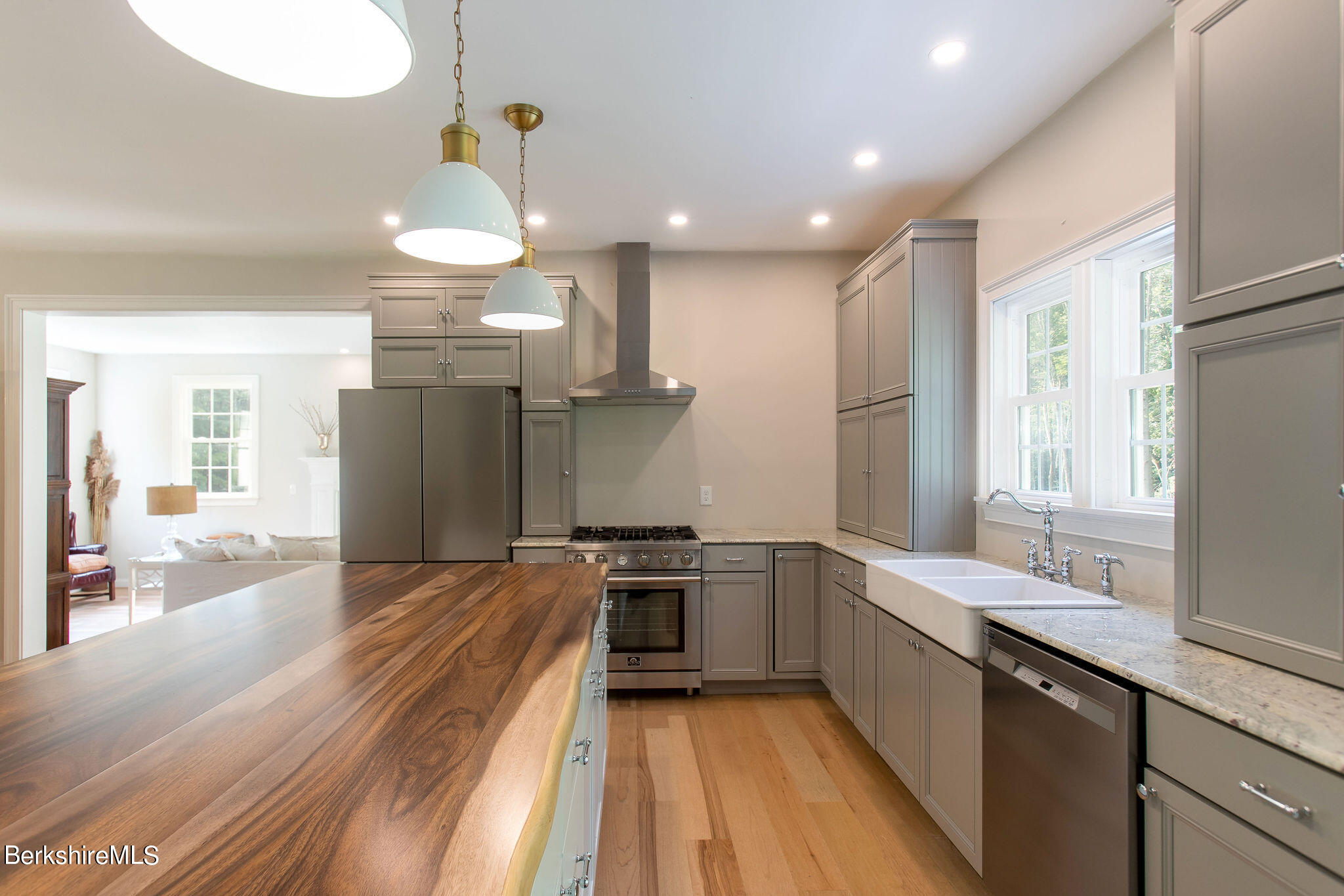 897 Canaan Valley Road New Marlborough, MA 01259 - Photo 10 of 50 a kitchen with stainless steel appliances granite countertop a sink a stove and a refrigerator