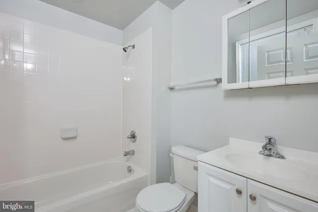 a bathroom with a sink toilet and vanity