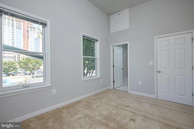 a view of an empty room with a window