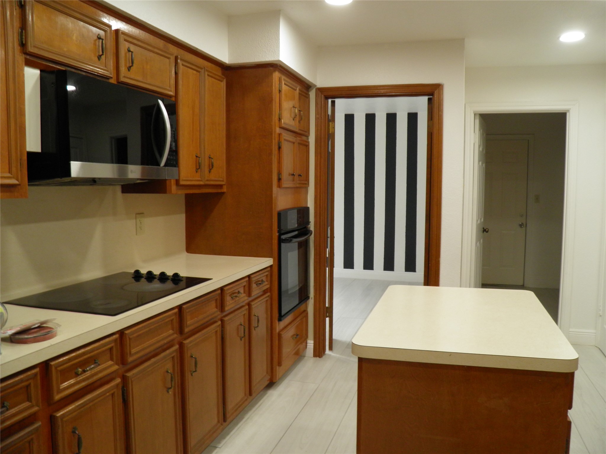 6819 Addicks Clodine Road Houston, TX 77083 - Photo 7 of 28 a kitchen that has a sink and a refrigerator