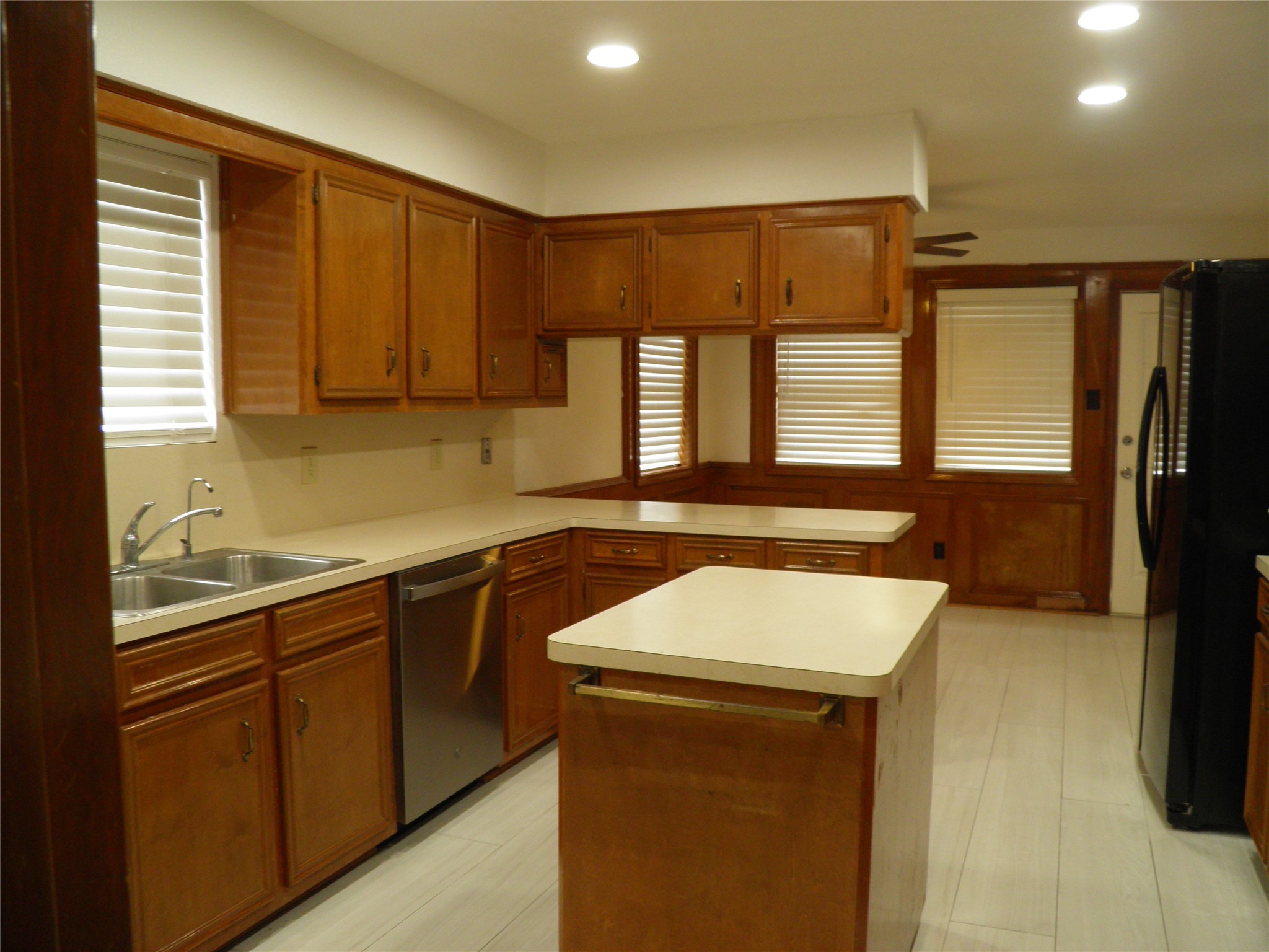 6819 Addicks Clodine Road Houston, TX 77083 - Photo 9 of 28 a kitchen that has a sink and a stove in it