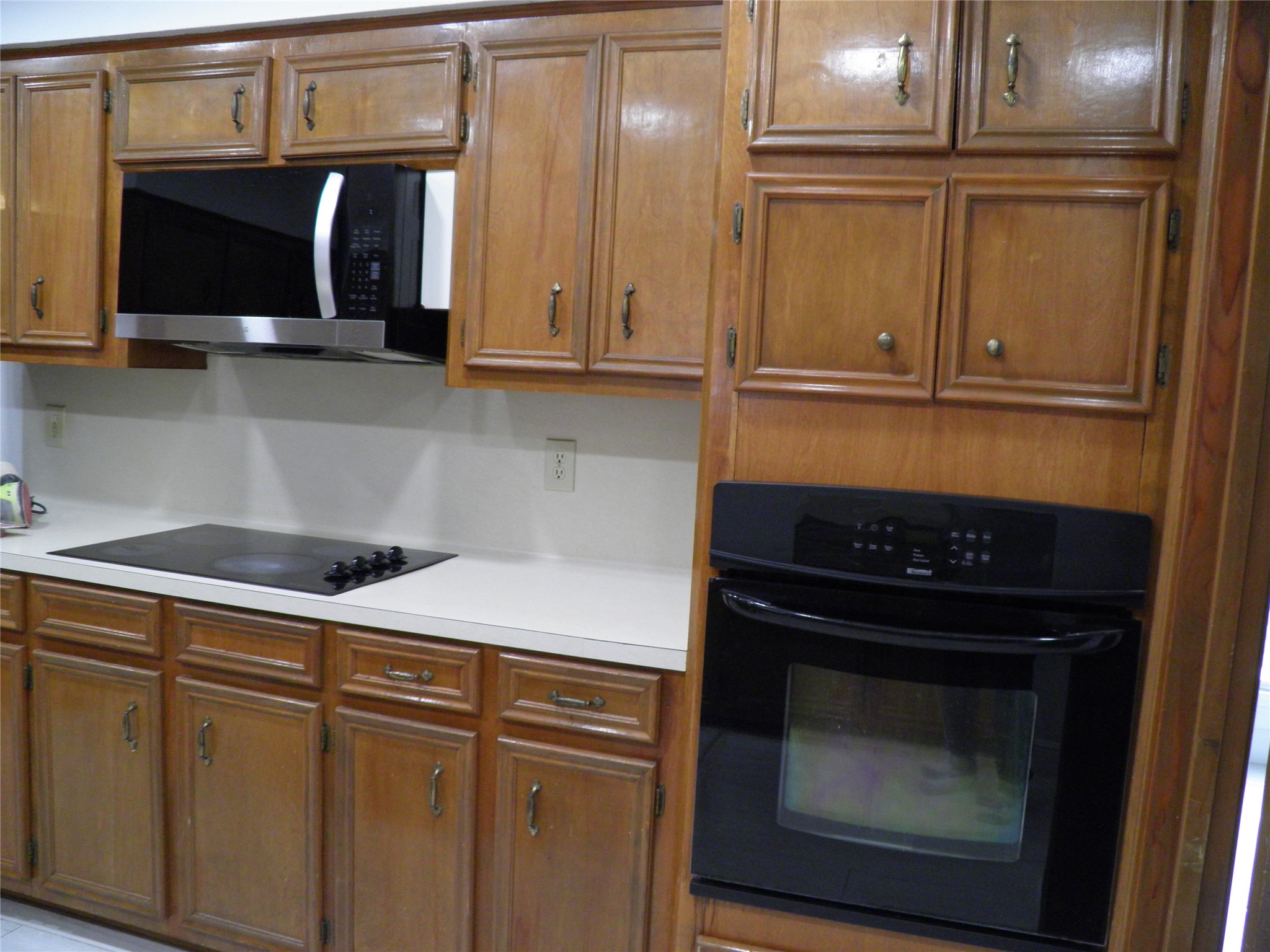 6819 Addicks Clodine Road Houston, TX 77083 - Photo 10 of 28 a kitchen with granite countertop cabinets and steel stainless steel appliances