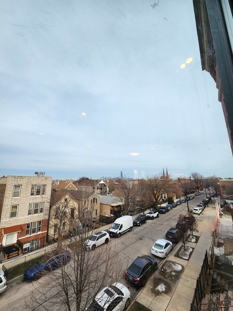 2345 West 23rd Street, Unit 3 Chicago, IL 60608 - Photo 2 of 7 an aerial view of residential building and parking space