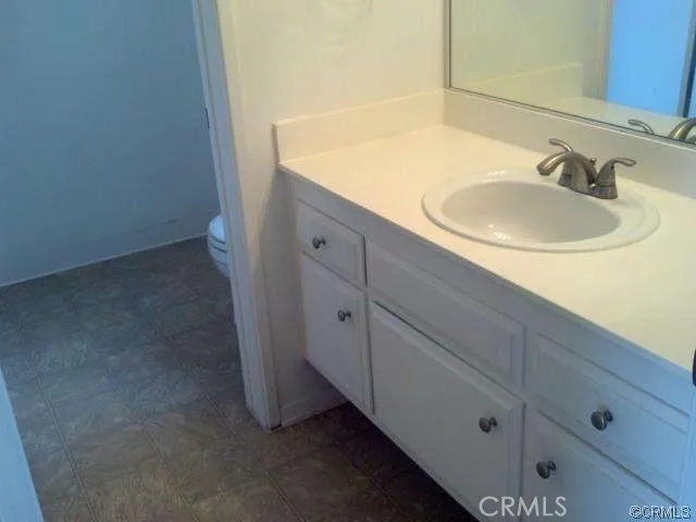 a bathroom with a toilet and a sink