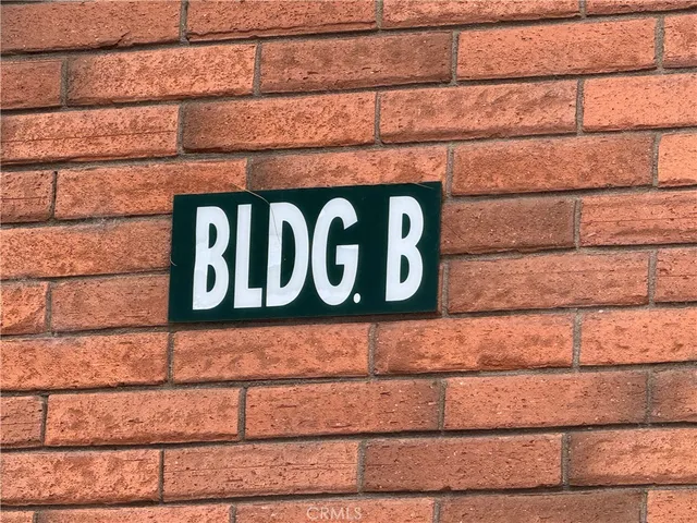 a view of a house with backyard porch and sitting area