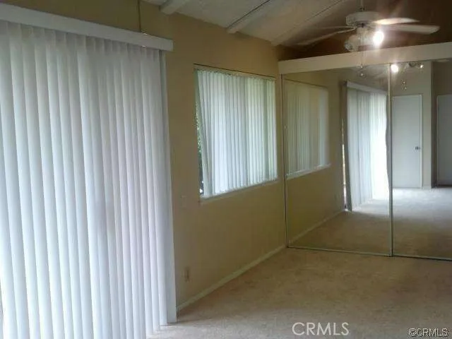 a kitchen with a refrigerator and a sink