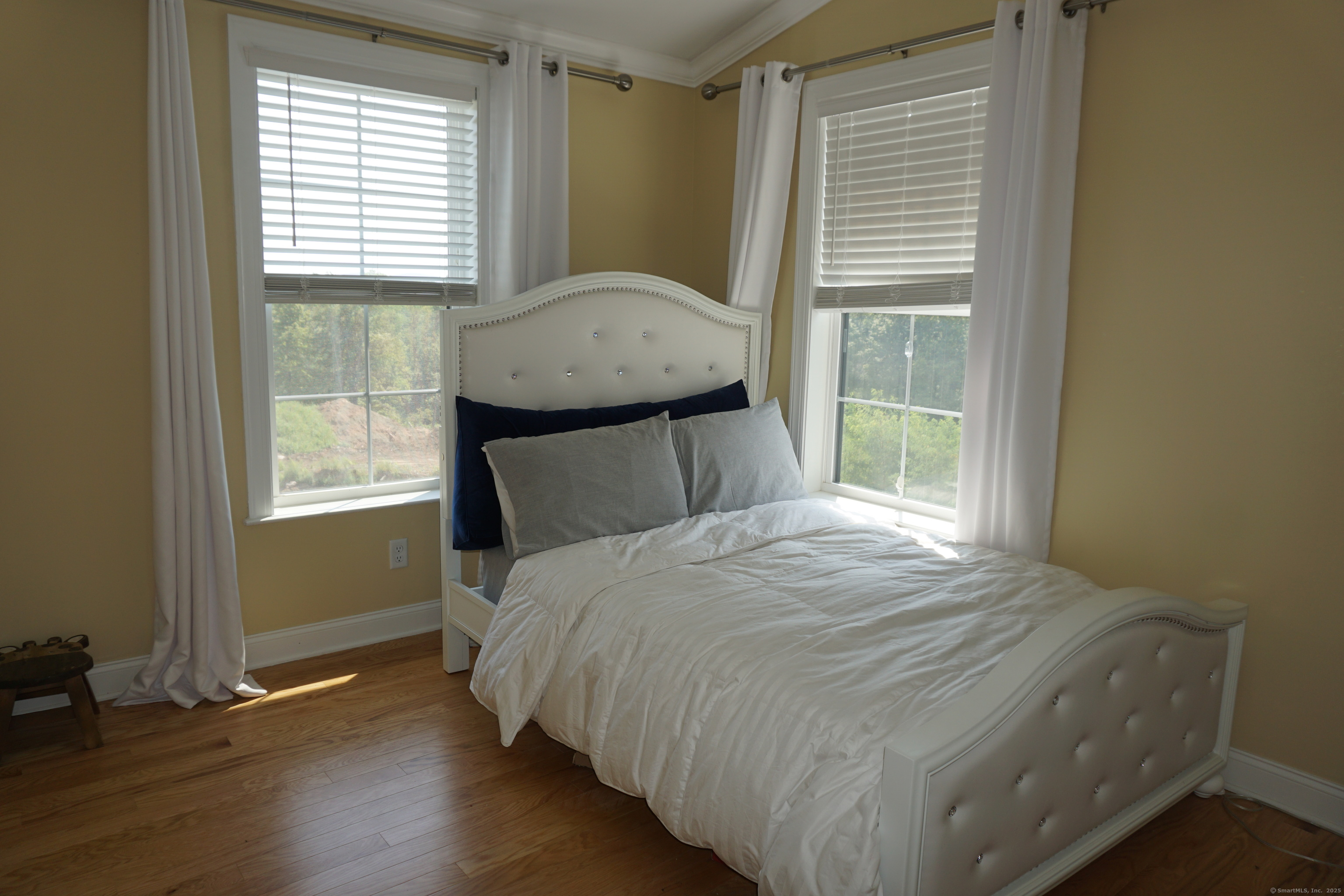 127 Brentwood Circle, Unit 127 Danbury, CT 06810 - Photo 15 of 23 a bedroom with a bed and a window