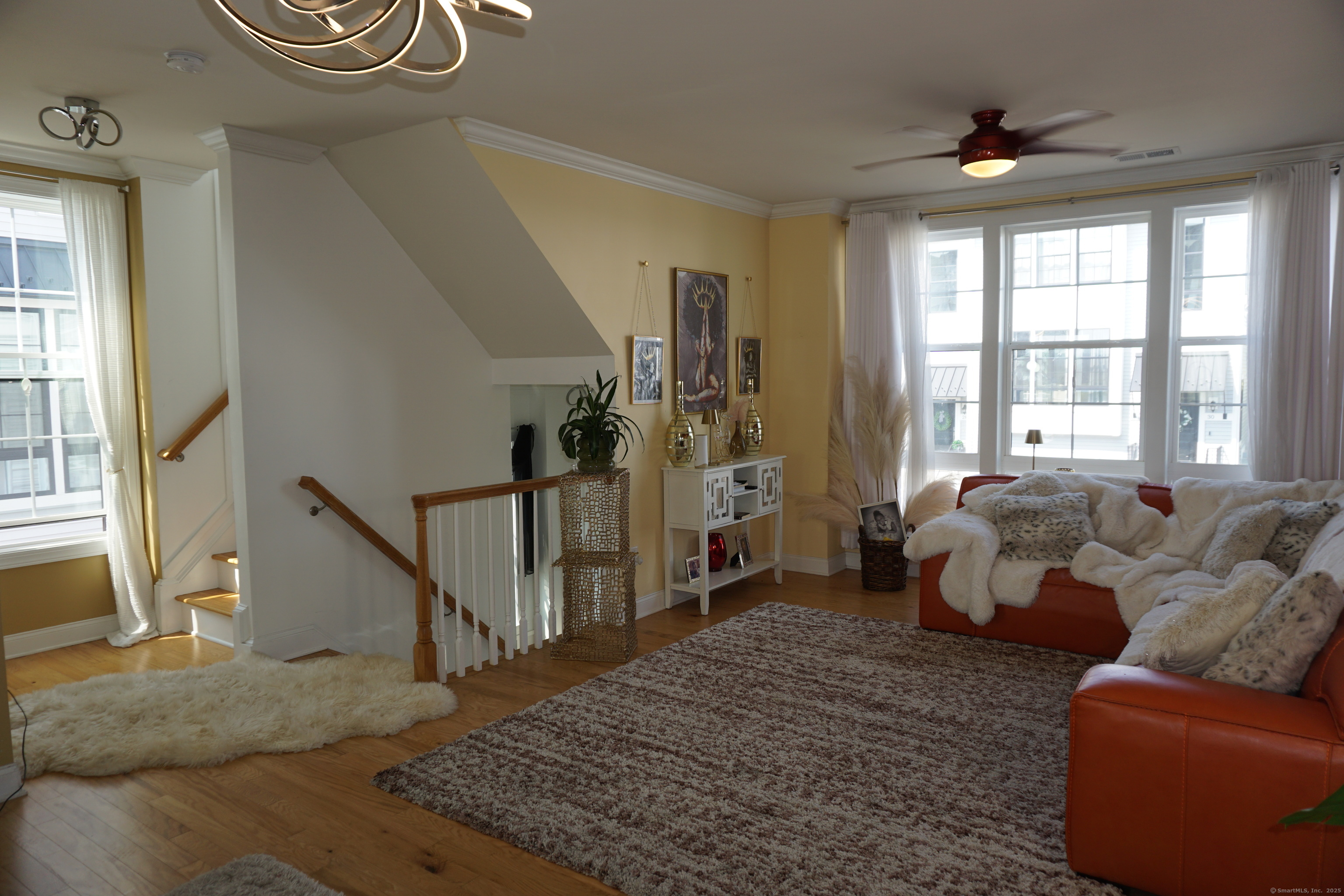 127 Brentwood Circle, Unit 127 Danbury, CT 06810 - Photo 2 of 23 a living room with furniture and a floor to ceiling window