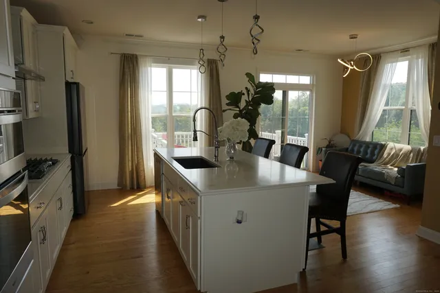 a dining room with furniture and wooden floor
