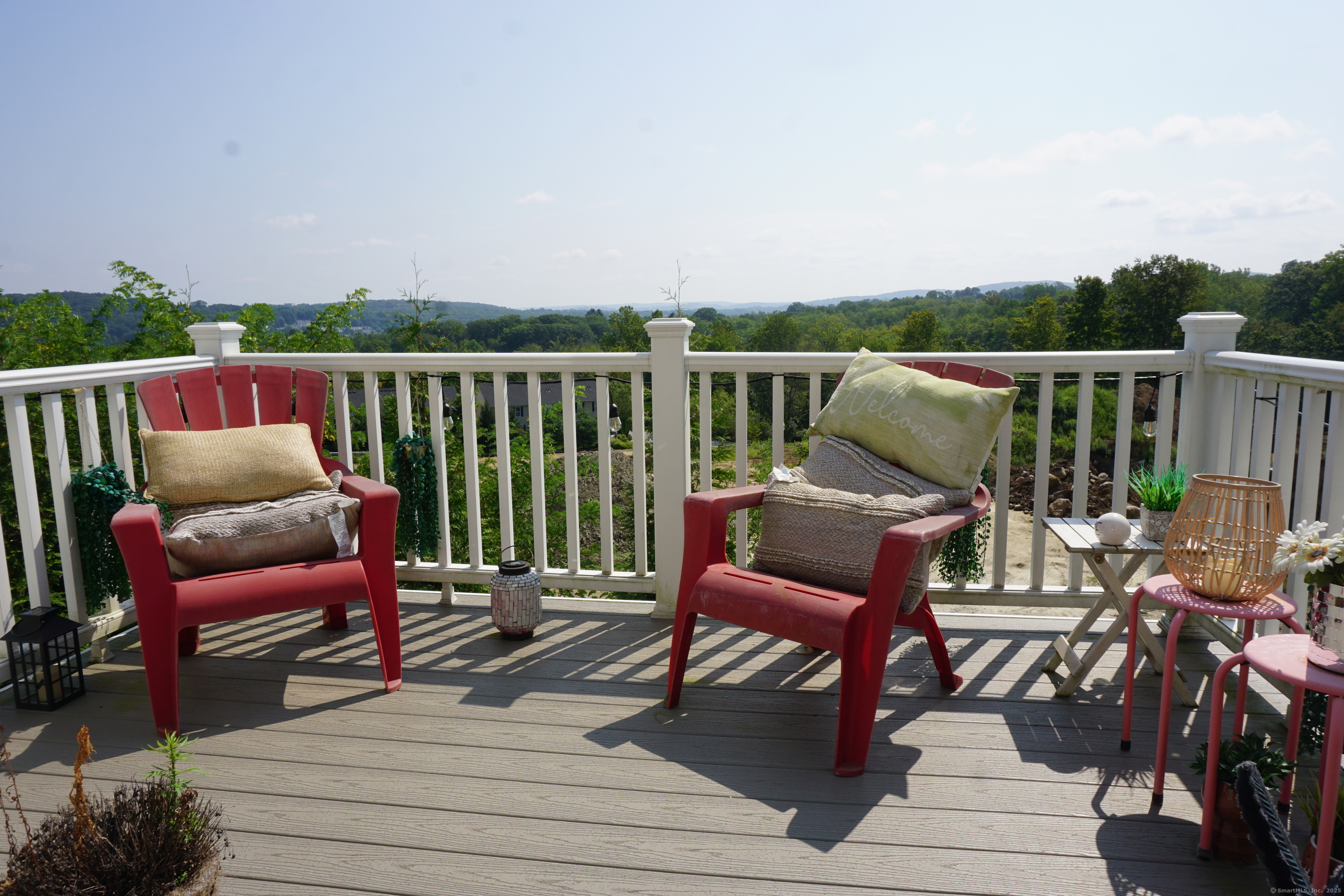 127 Brentwood Circle, Unit 127 Danbury, CT 06810 - Photo 9 of 23 a roof deck with a couple of chairs