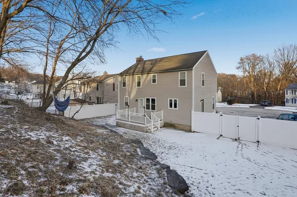 a view of a house with a snow in the yard