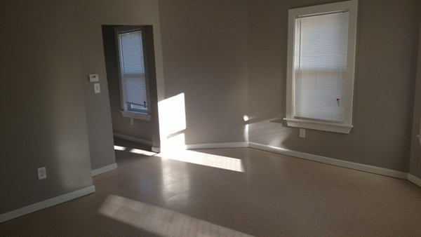 89-91 Cambridge Street Springfield, MA 01109 - Photo 3 of 9 an empty room with an empty space and a window