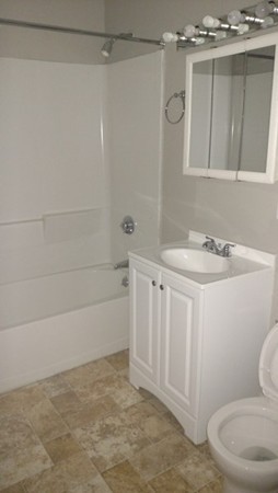 89-91 Cambridge Street Springfield, MA 01109 - Photo 5 of 9 a bathroom with a sink a toilet and shower