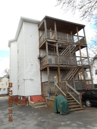 89-91 Cambridge Street Springfield, MA 01109 - Photo 8 of 9 a front view of a house with parking