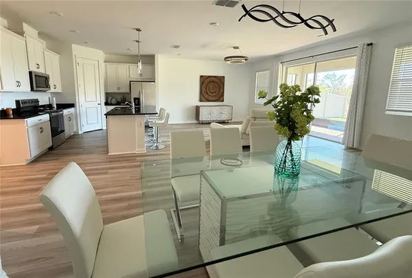 a view of kitchen and dining area with furniture