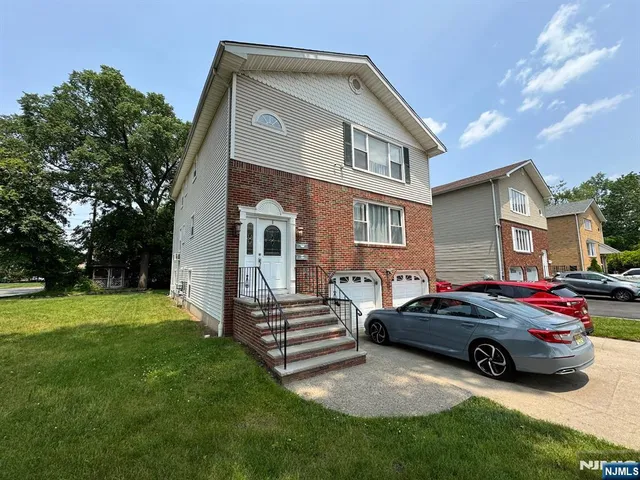 a view of house with backyard
