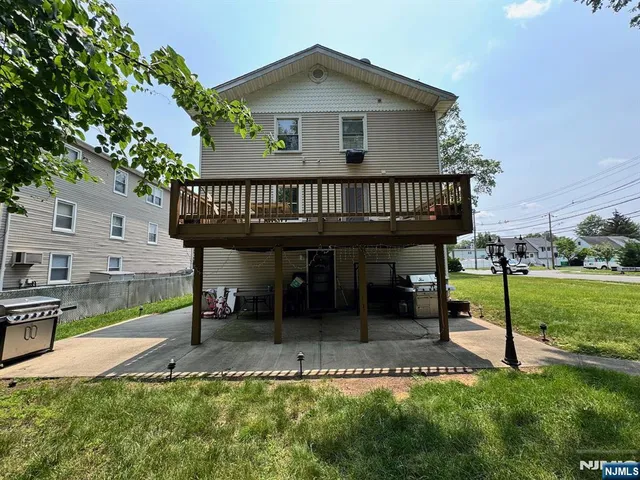a house view with a sitting space and garden