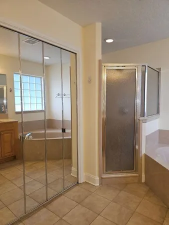 a bathroom with a shower and a sink
