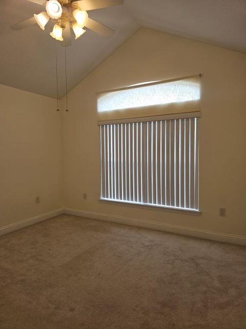 4695 Lovegrass Lane Crestview, FL 32539 - Photo 17 of 27 a view of an empty room with a chandelier fan