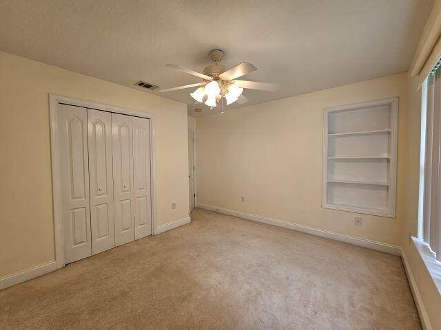 4695 Lovegrass Lane Crestview, FL 32539 - Photo 22 of 27 a view of an empty room with a fan