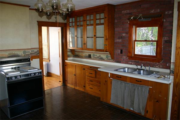 34-38 Ayer Road Shirley, MA 01464 - Photo 8 of 9 a kitchen with a sink stove and cabinets
