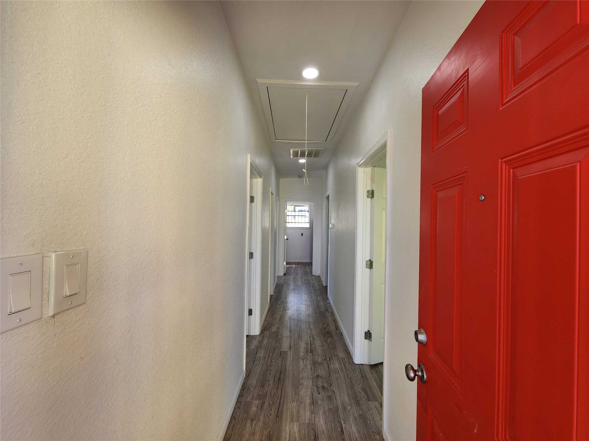 2706 1/2 Berry Street Houston, TX 77004 - Photo 3 of 14 a view of a hallway with wooden floor